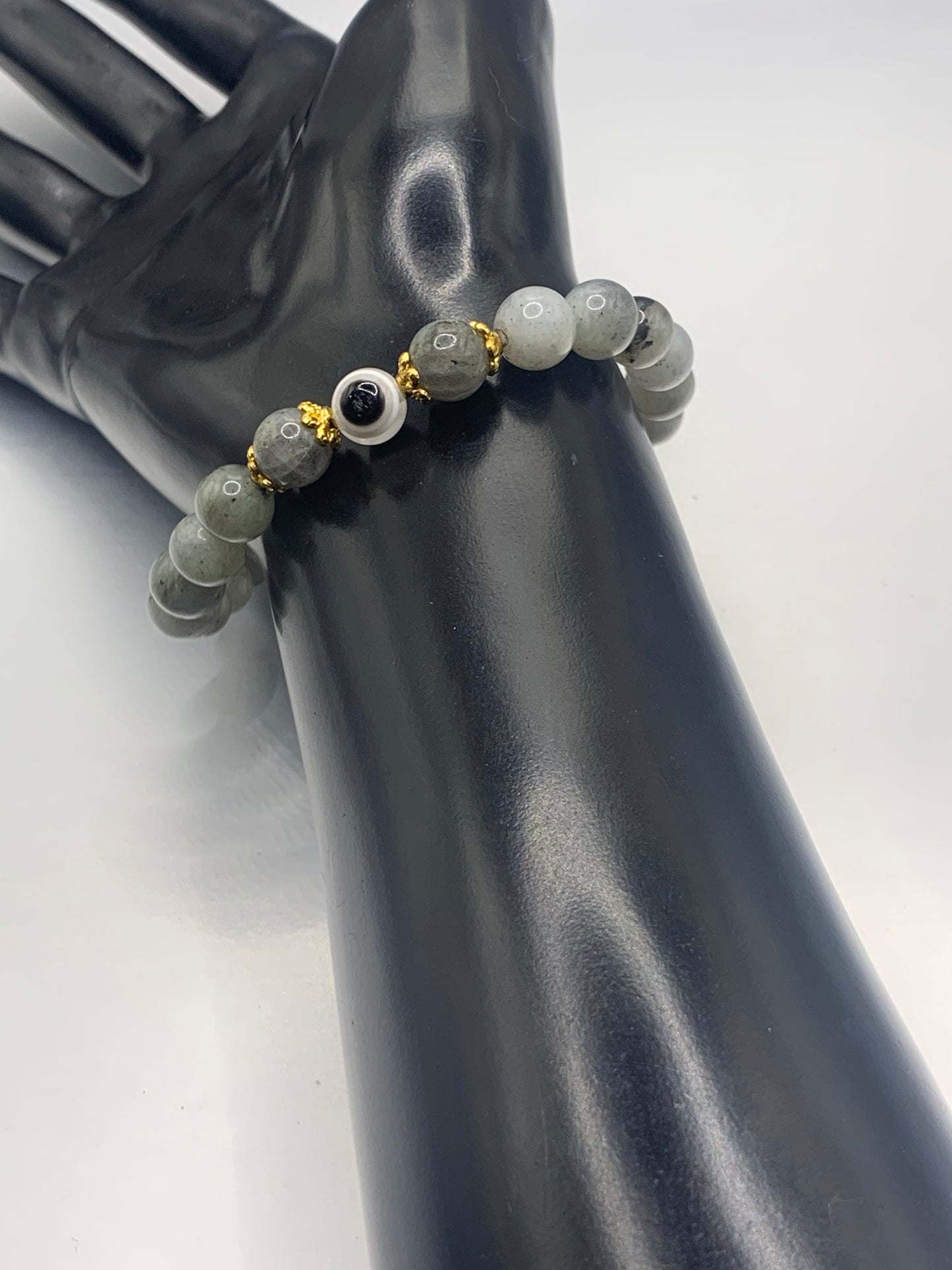 This bracelet features labradorite beads and a colorful evil eye resin bead with gold flower caps. These are 8mm beads, made with elastic string to stretch onto the wrist and is approximately 17 cm or 6.7 inches



These are natural semi-precious stones/crystals. Even if they are dyed, the base material is still natural and imperfections are common making them unique
