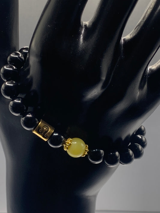 Leo Zodiac black obsidian with yellow jade elastic beaded bracelet with gold accents