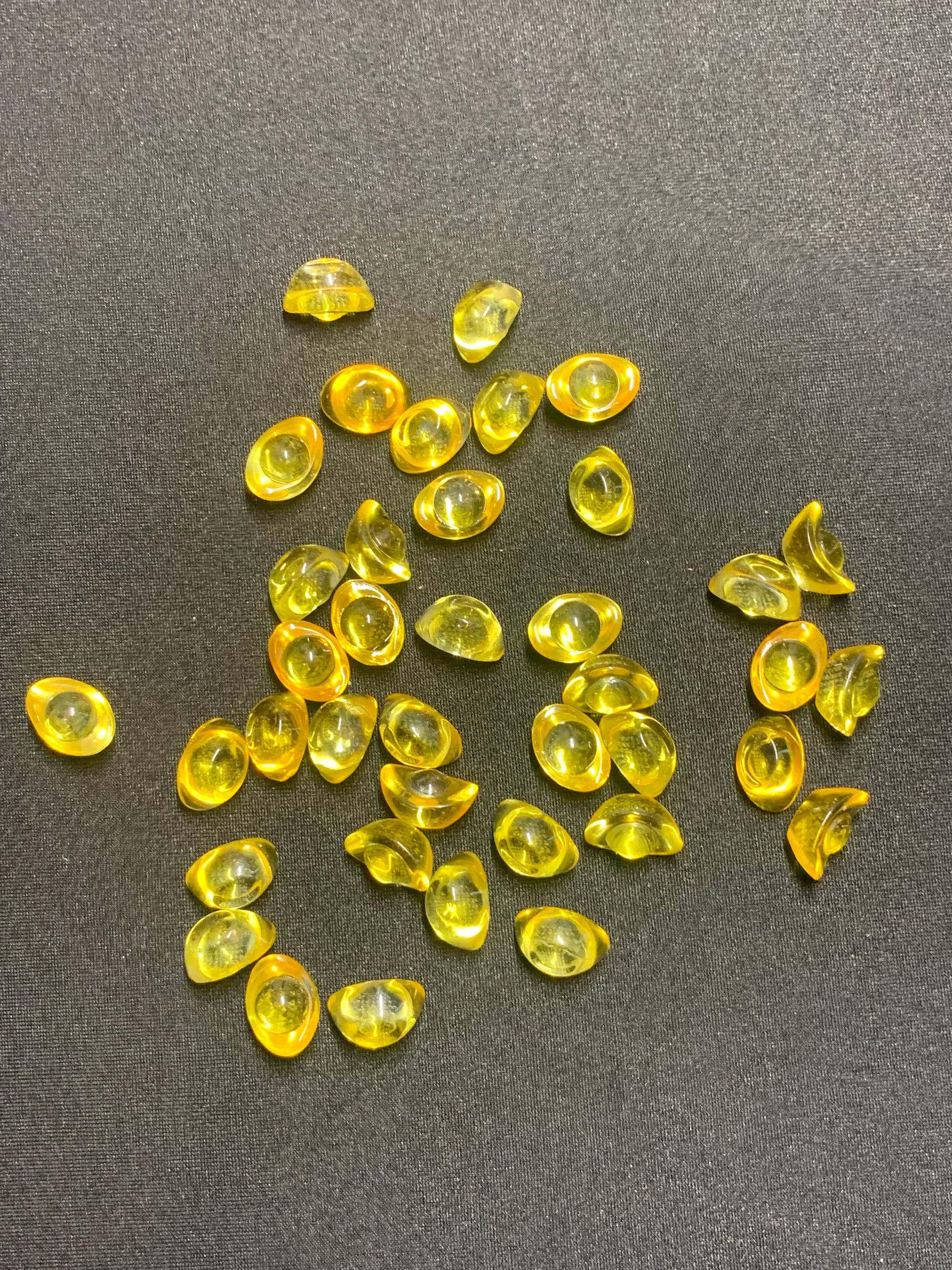 Yellow gemstones on a dark gray background. Lucky winner