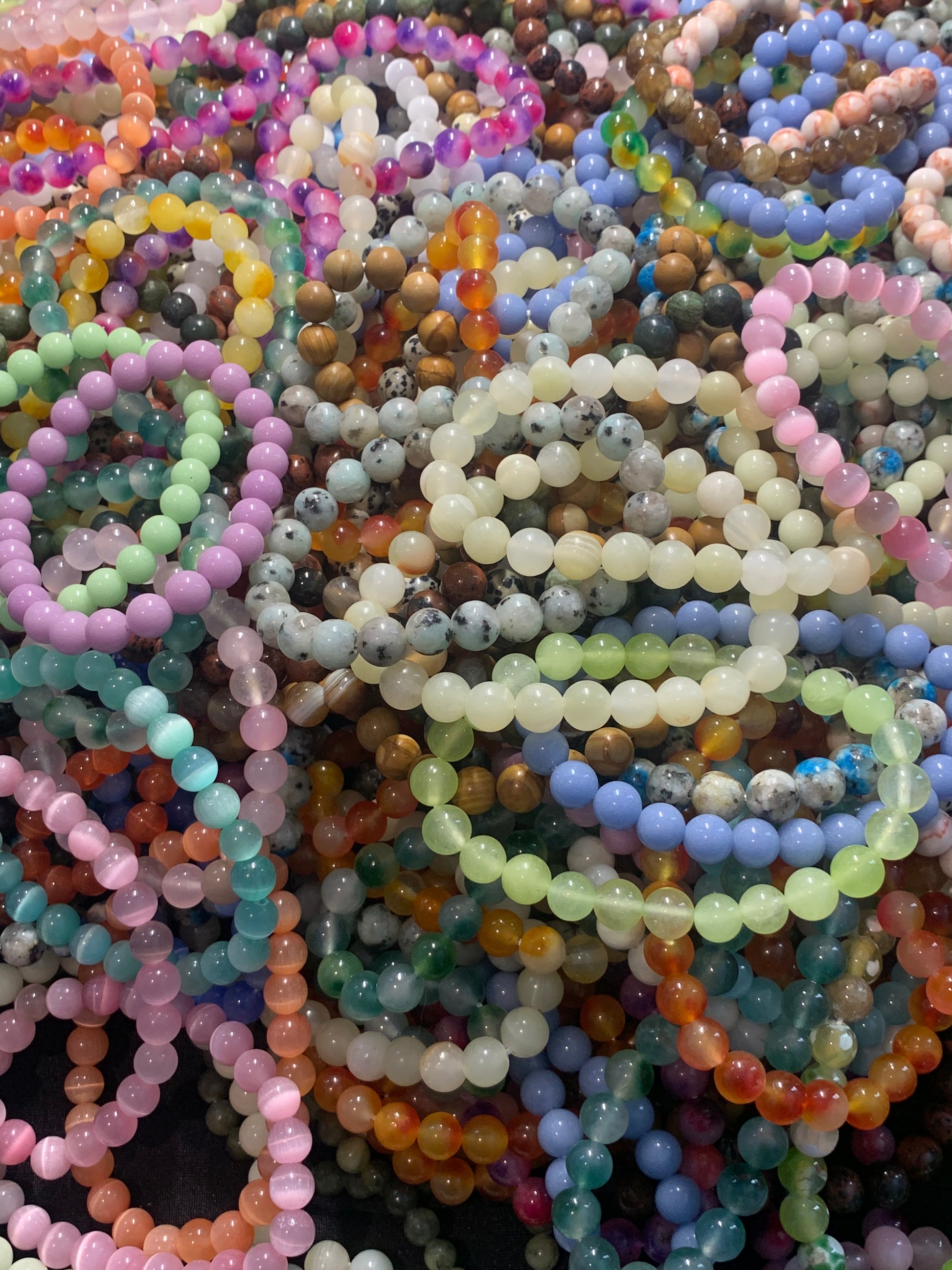 Close-up of multicolored beaded bracelets.
