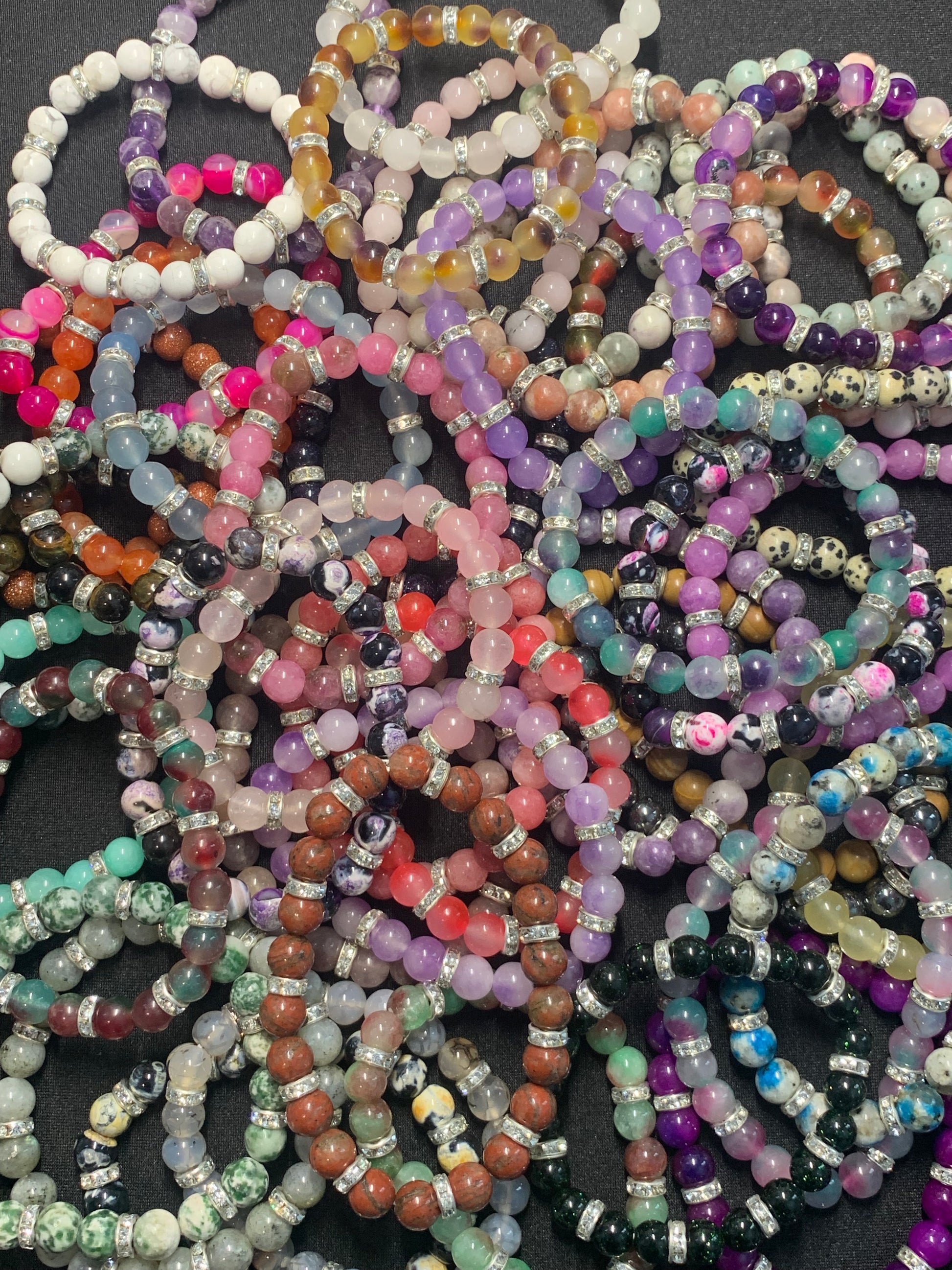 Multicolored beaded bracelets on a dark surface