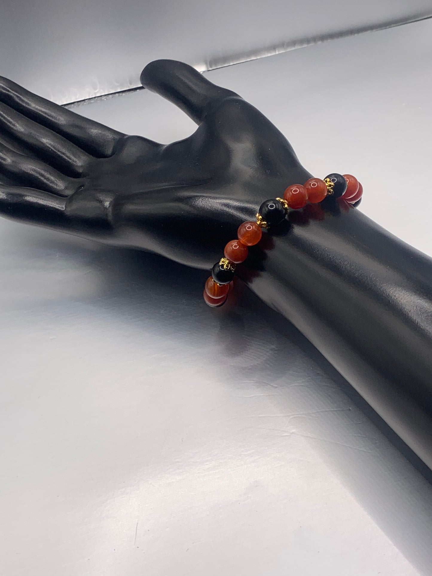 Black obsidian with orange agate semi precious stone/crystal beaded elastic bracelet with gold plated flower bead caps