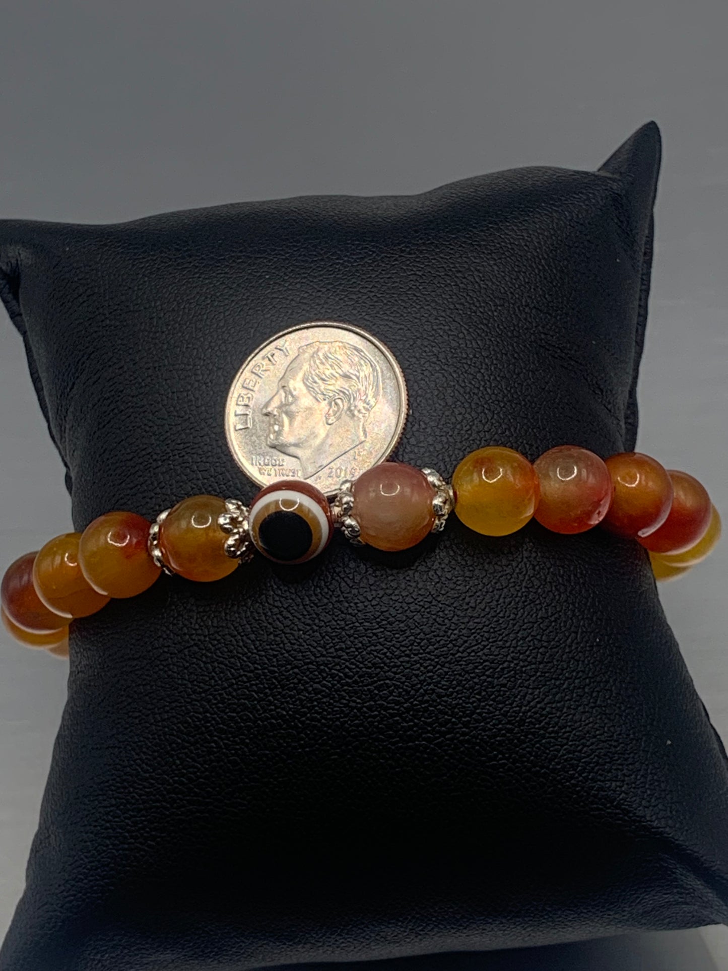 Orange blossom chalcedony semi precious stone/crystal with resin evil eye beaded elastic bracelet