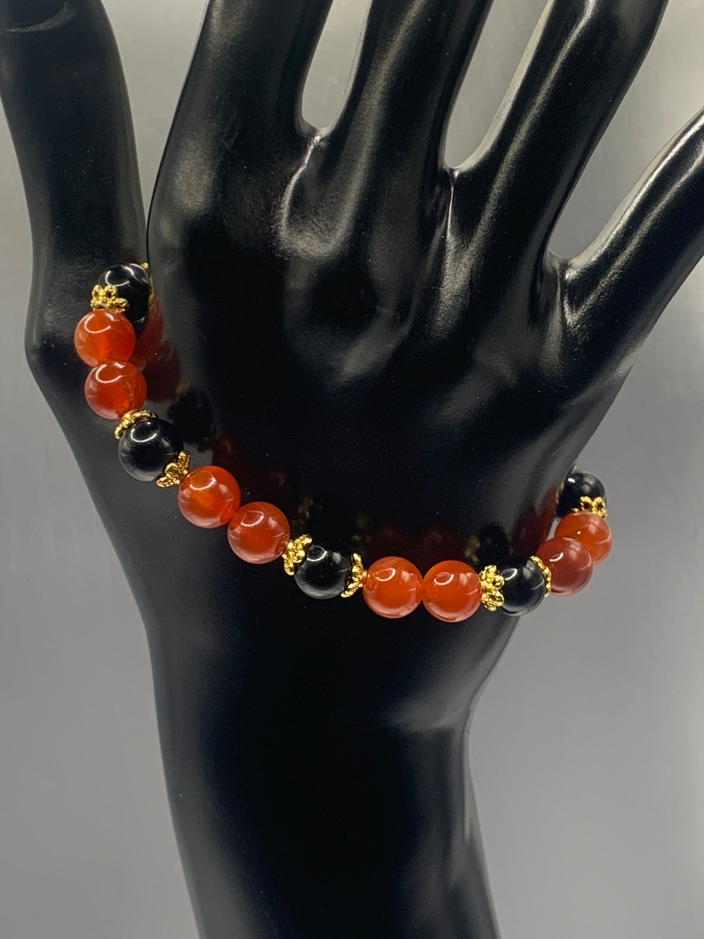 Black obsidian with orange agate semi precious stone/crystal beaded elastic bracelet with gold plated flower bead caps