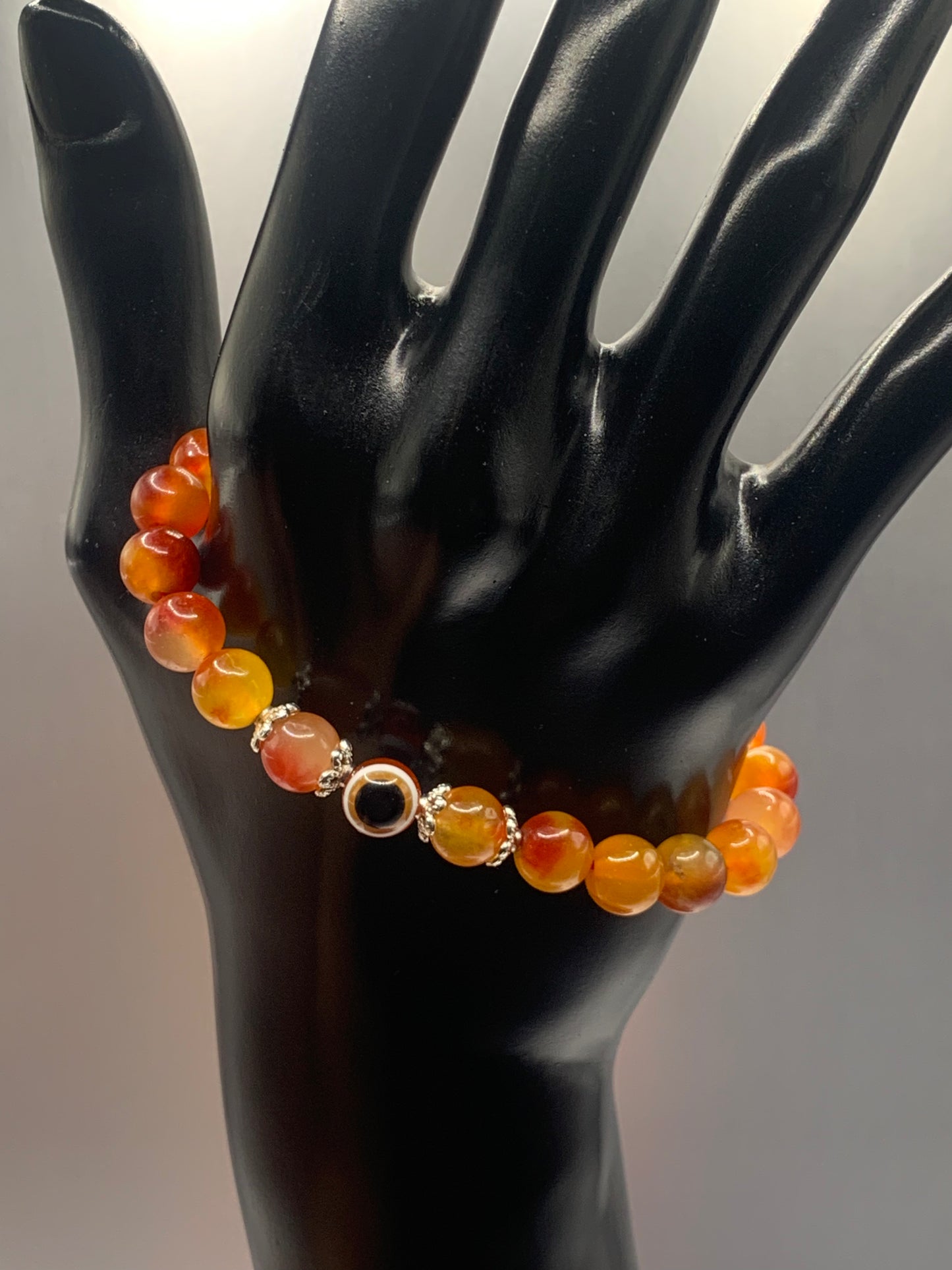 Orange blossom chalcedony semi precious stone/crystal with resin evil eye beaded elastic bracelet