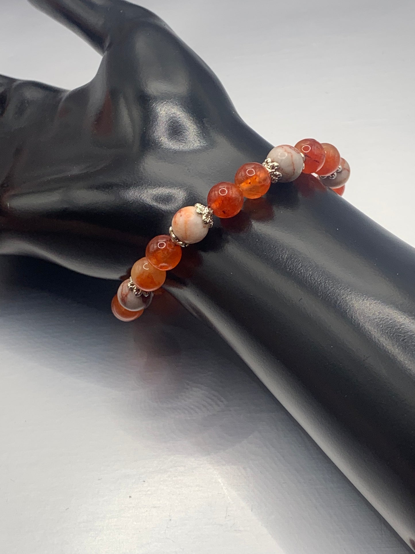 Red vein jasper and phoenix agate semi precious stone/crystal elastic beaded bracelet with silver plated flower bead caps