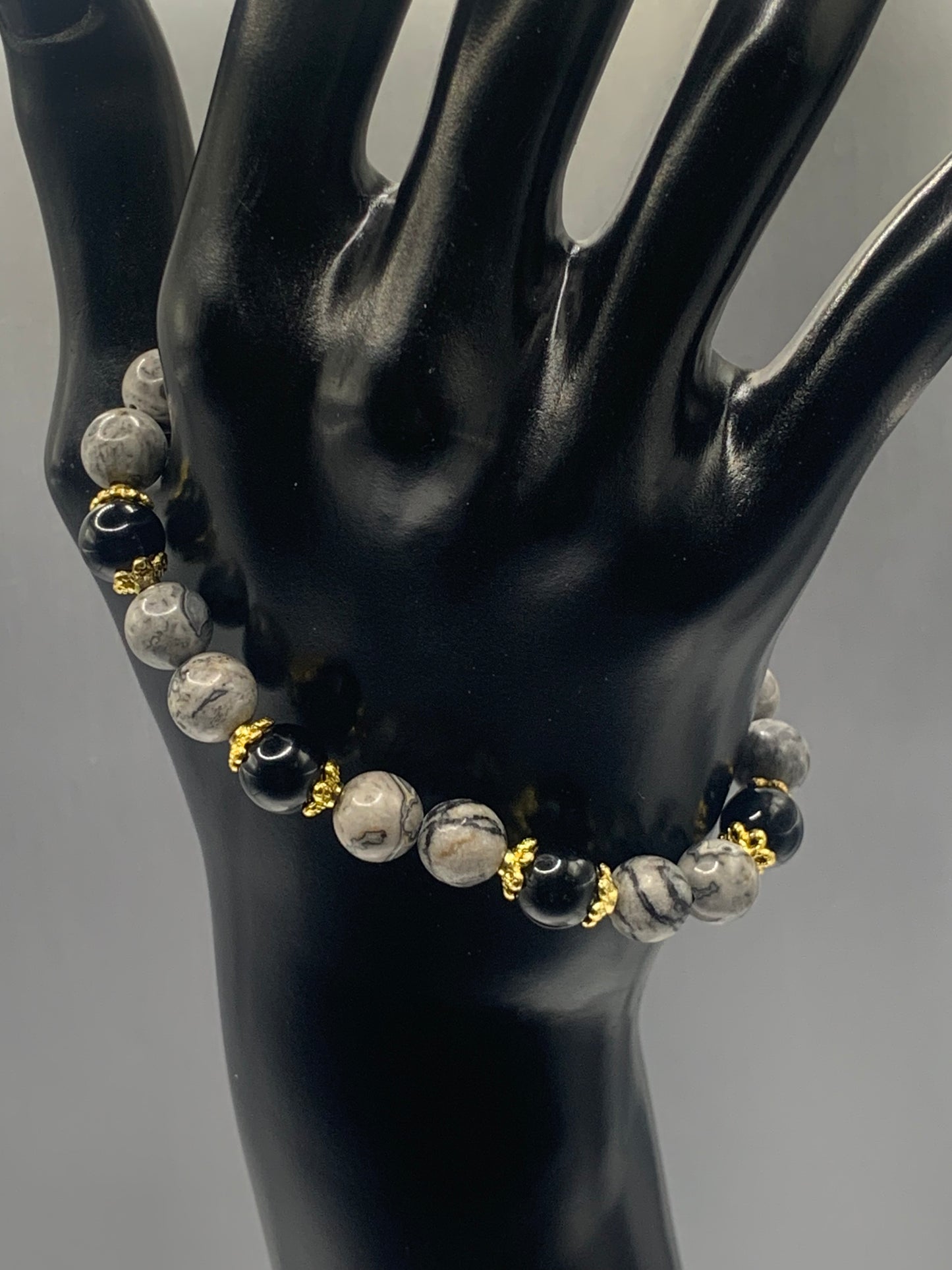 Black obsidian with picasso jasper semi precious stone/crystal beaded elastic bracelet with gold plated flower bead caps