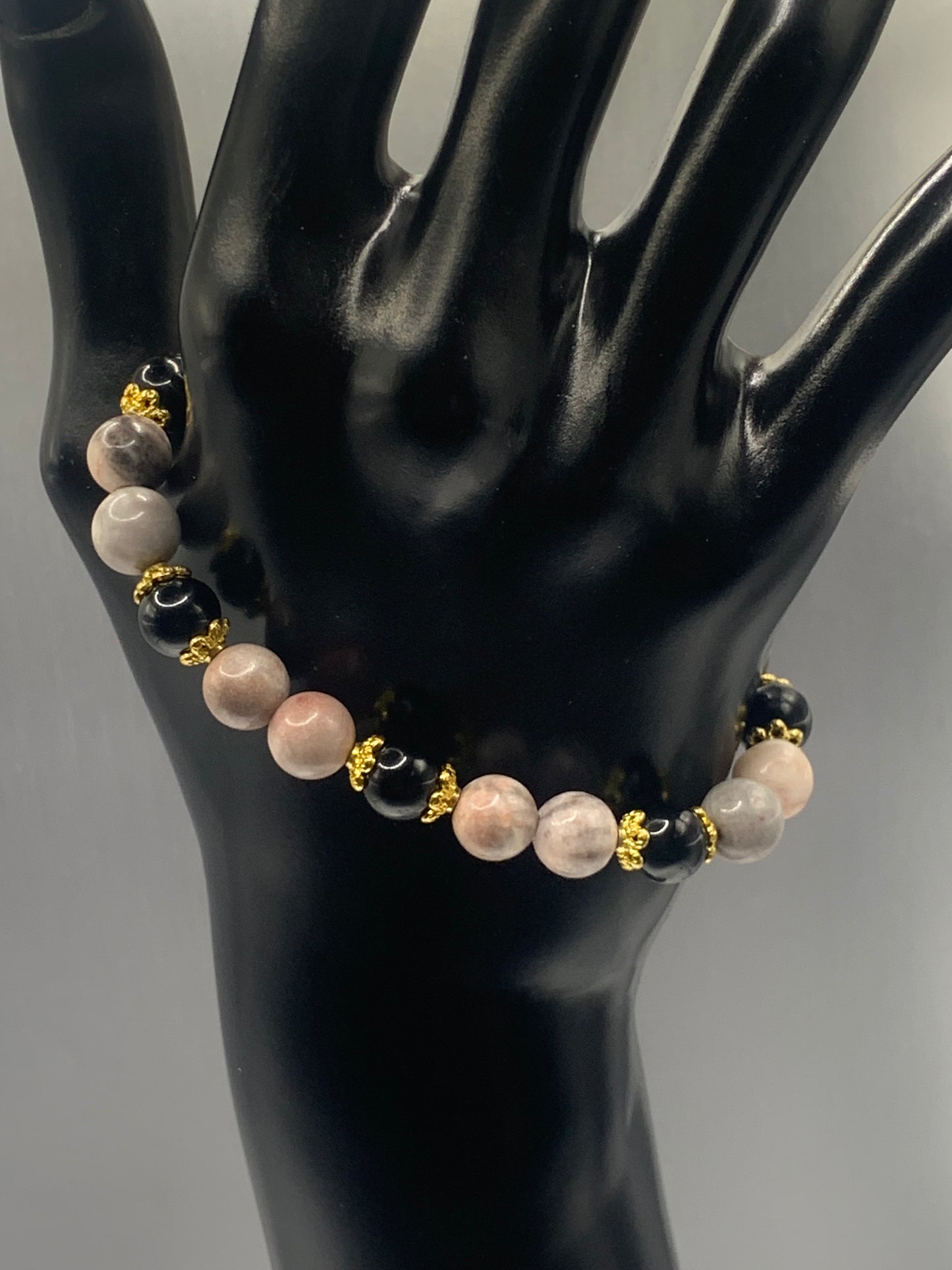 Black obsidian with pink zebra jasper semi precious stone/crystal beaded elastic bracelet with gold plated flower bead caps