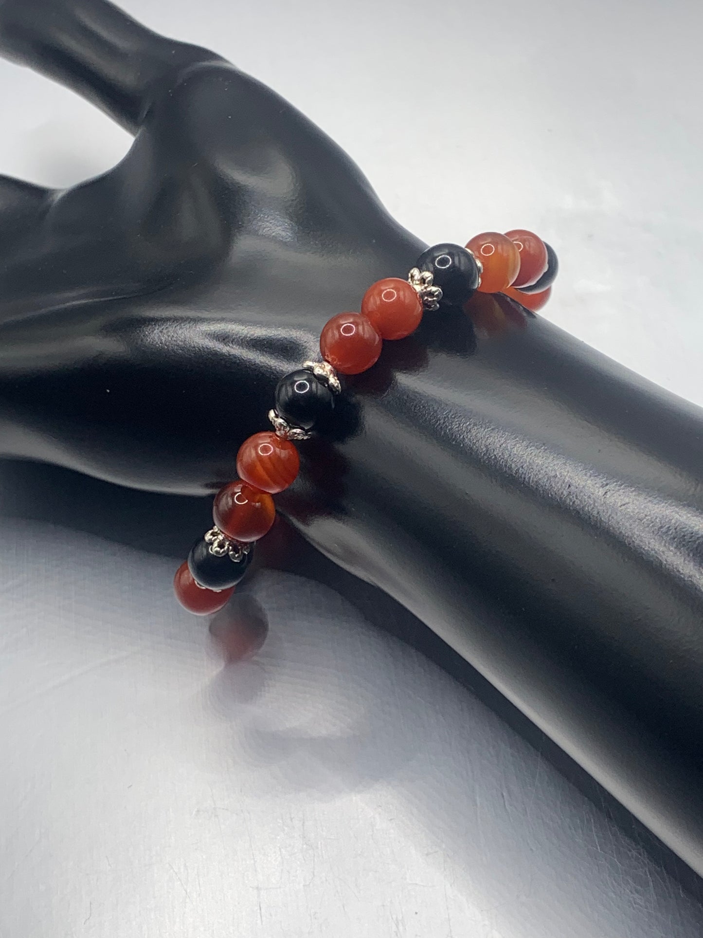Black obsidian with red agate semi precious stone/crystal beaded elastic bracelet with silver plated flower bead caps