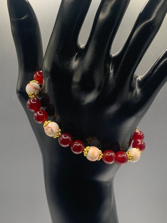 Red vein jasper and red chalcedony semi precious stone/crystal elastic beaded bracelet with gold plated flower bead caps