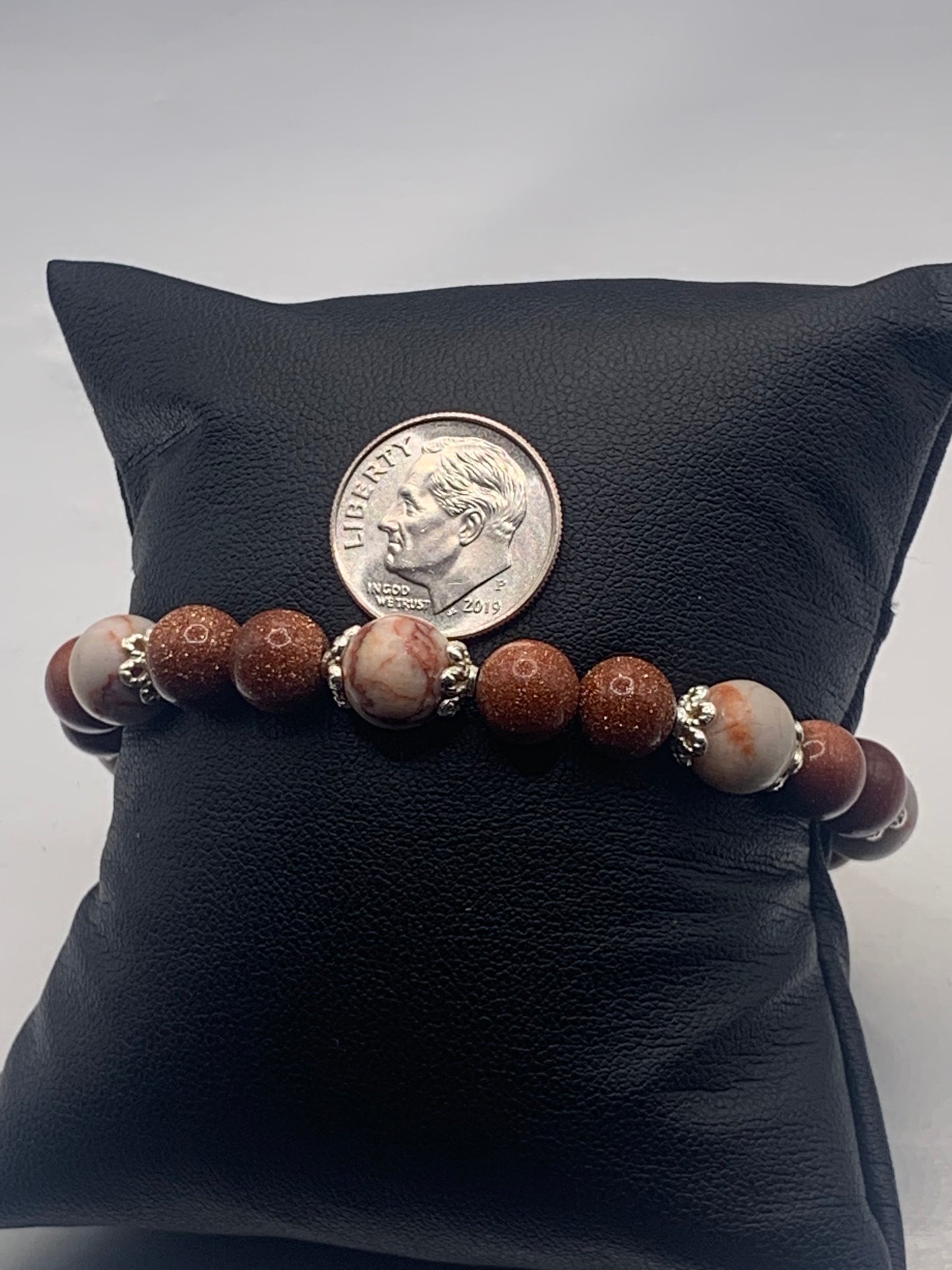 Red vein jasper and sandstone semi precious stone/crystal elastic beaded bracelet with silver plated flower bead caps
