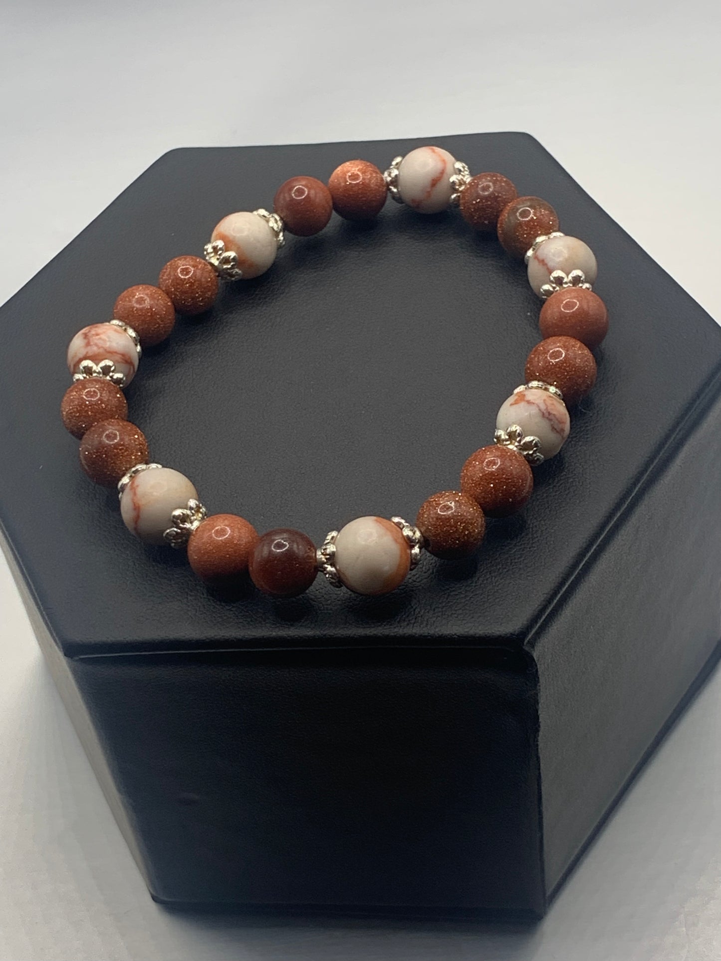 Red vein jasper and sandstone semi precious stone/crystal elastic beaded bracelet with silver plated flower bead caps