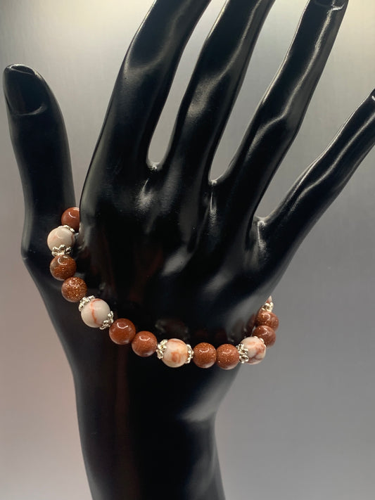Red vein jasper and sandstone semi precious stone/crystal elastic beaded bracelet with silver plated flower bead caps