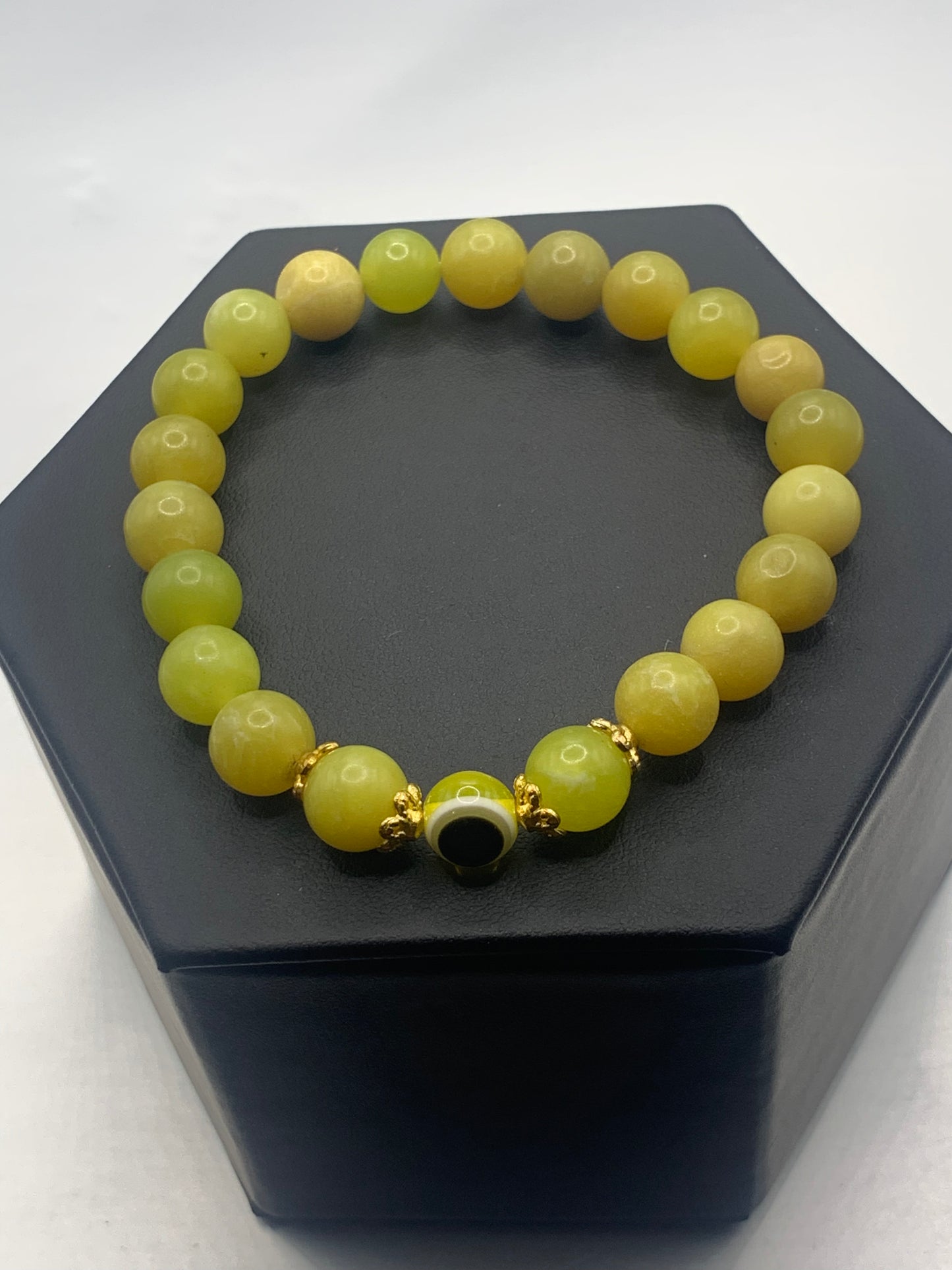 Yellow jade semi precious stone/crystal with resin evil eye beaded elastic bracelet