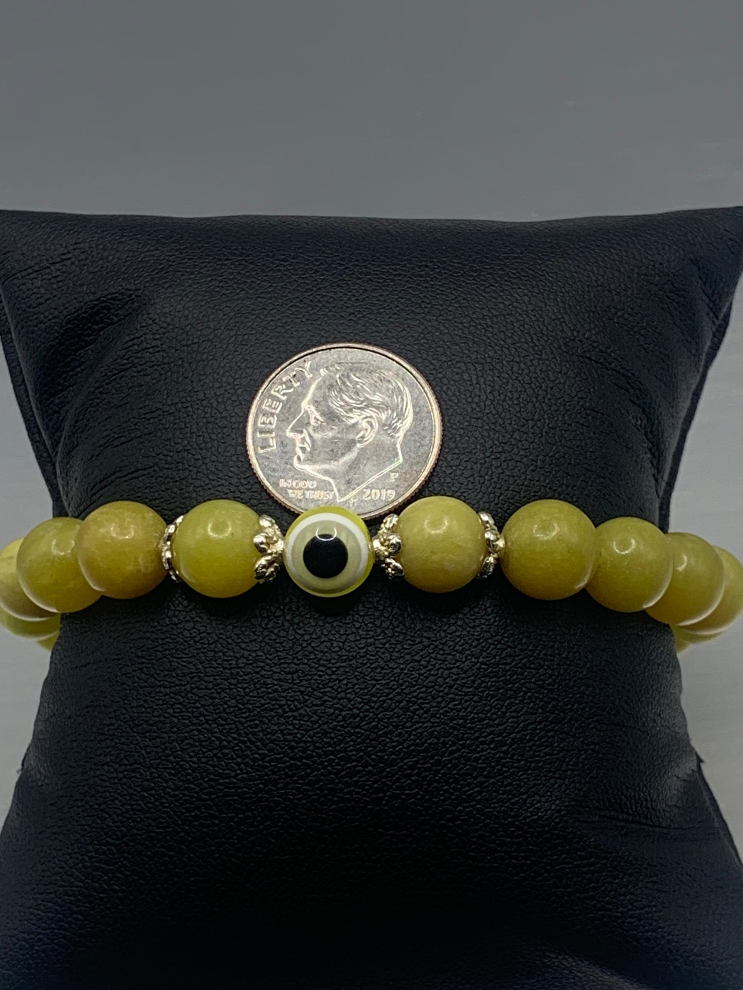 Yellow jade semi precious stone/crystal with resin evil eye beaded elastic bracelet