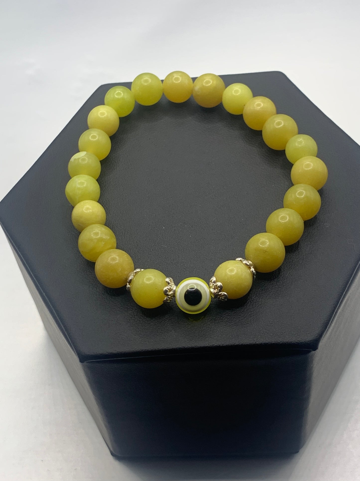 Yellow jade semi precious stone/crystal with resin evil eye beaded elastic bracelet