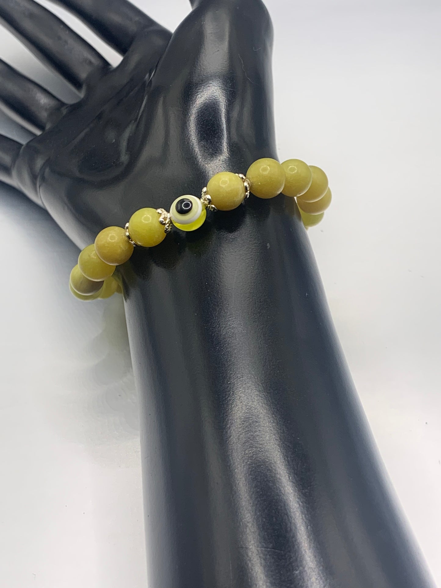 Yellow jade semi precious stone/crystal with resin evil eye beaded elastic bracelet