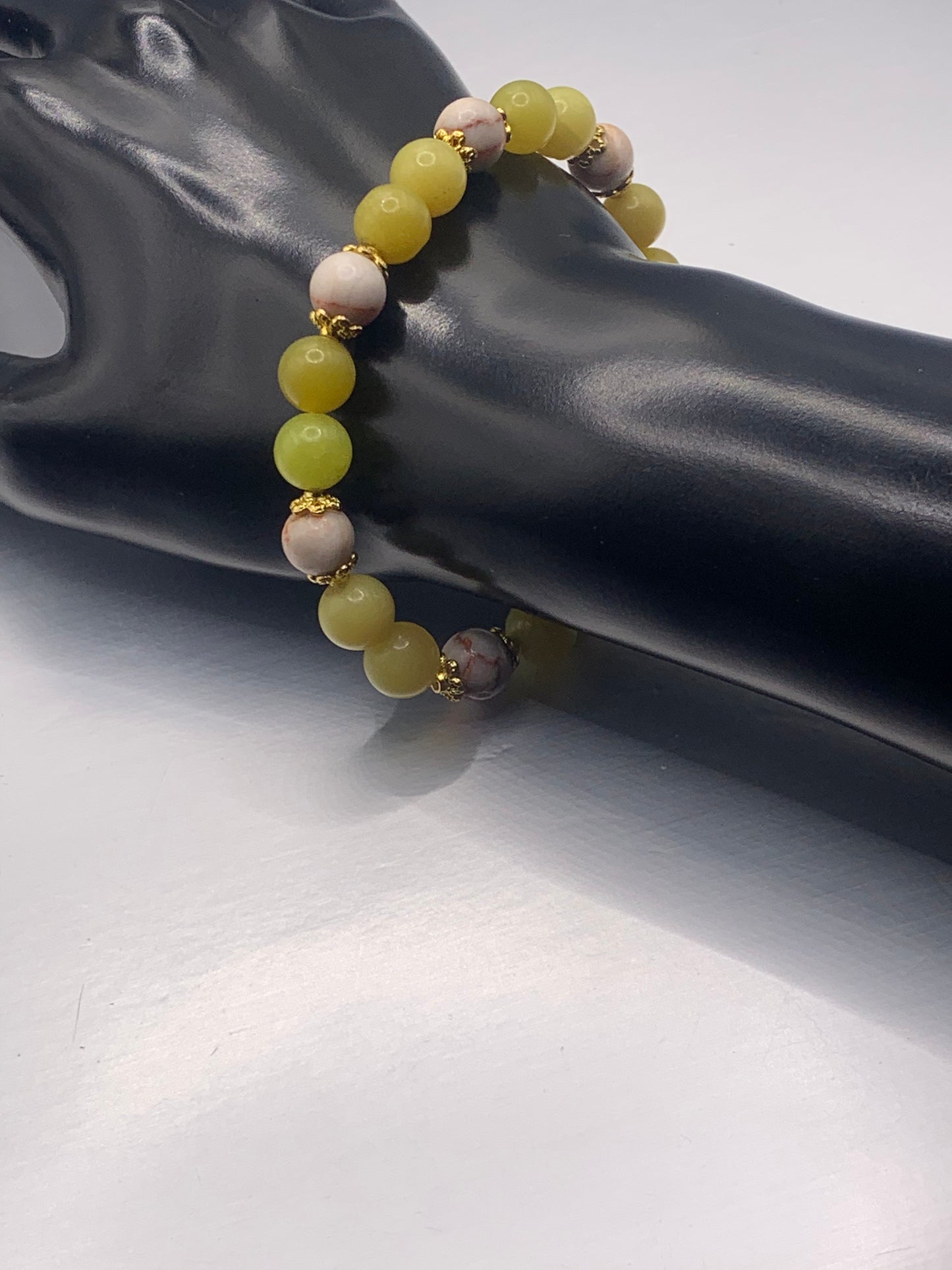 Red vein jasper and yellow jade semi precious stone/crystal elastic beaded bracelet with gold plated flower bead caps