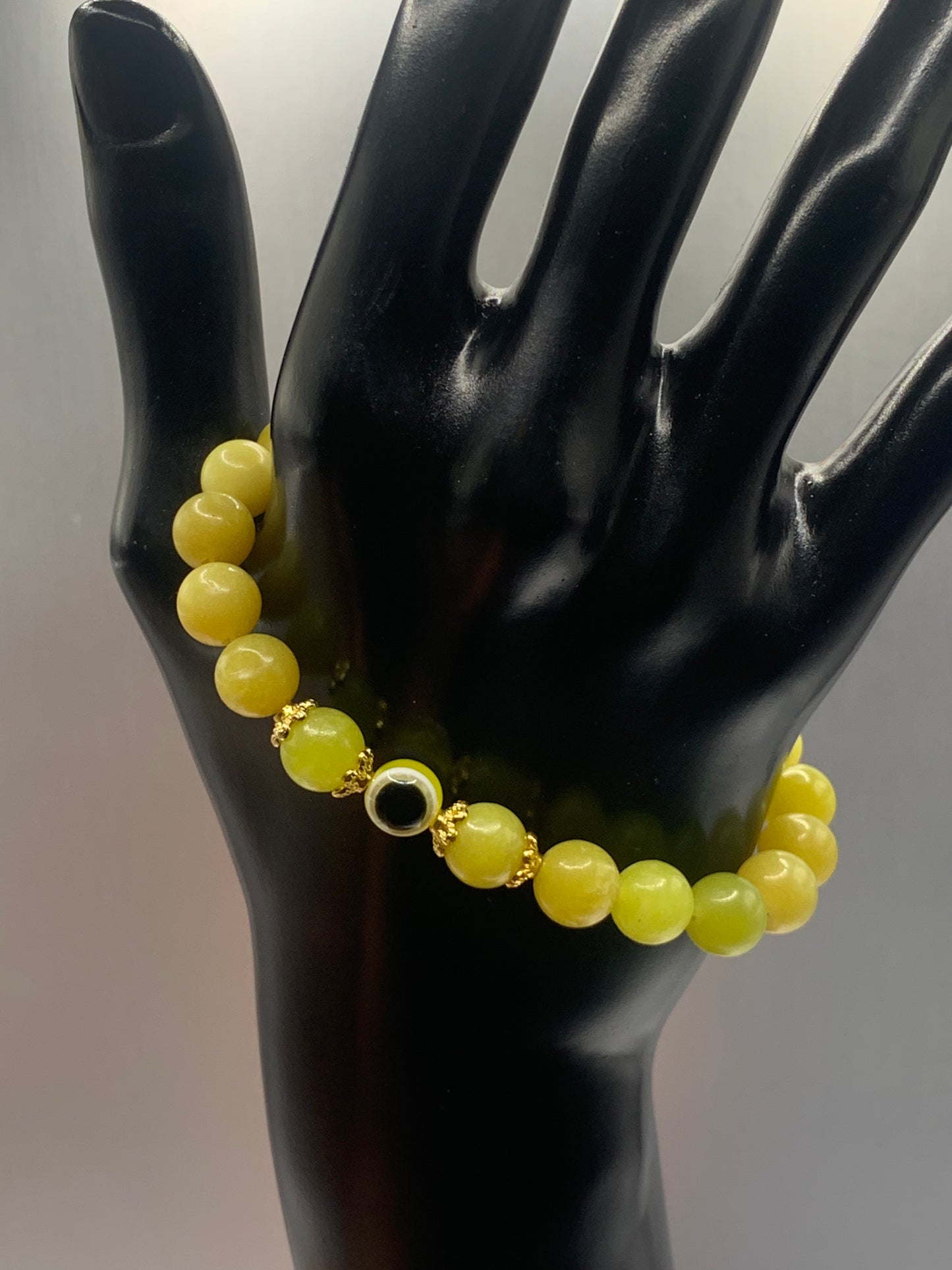 Yellow jade semi precious stone/crystal with resin evil eye beaded elastic bracelet