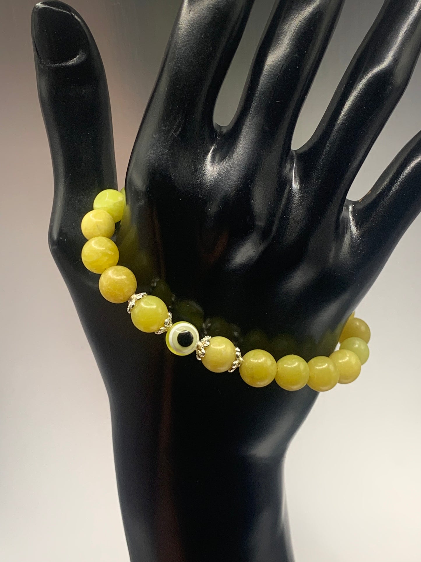 Yellow jade semi precious stone/crystal with resin evil eye beaded elastic bracelet