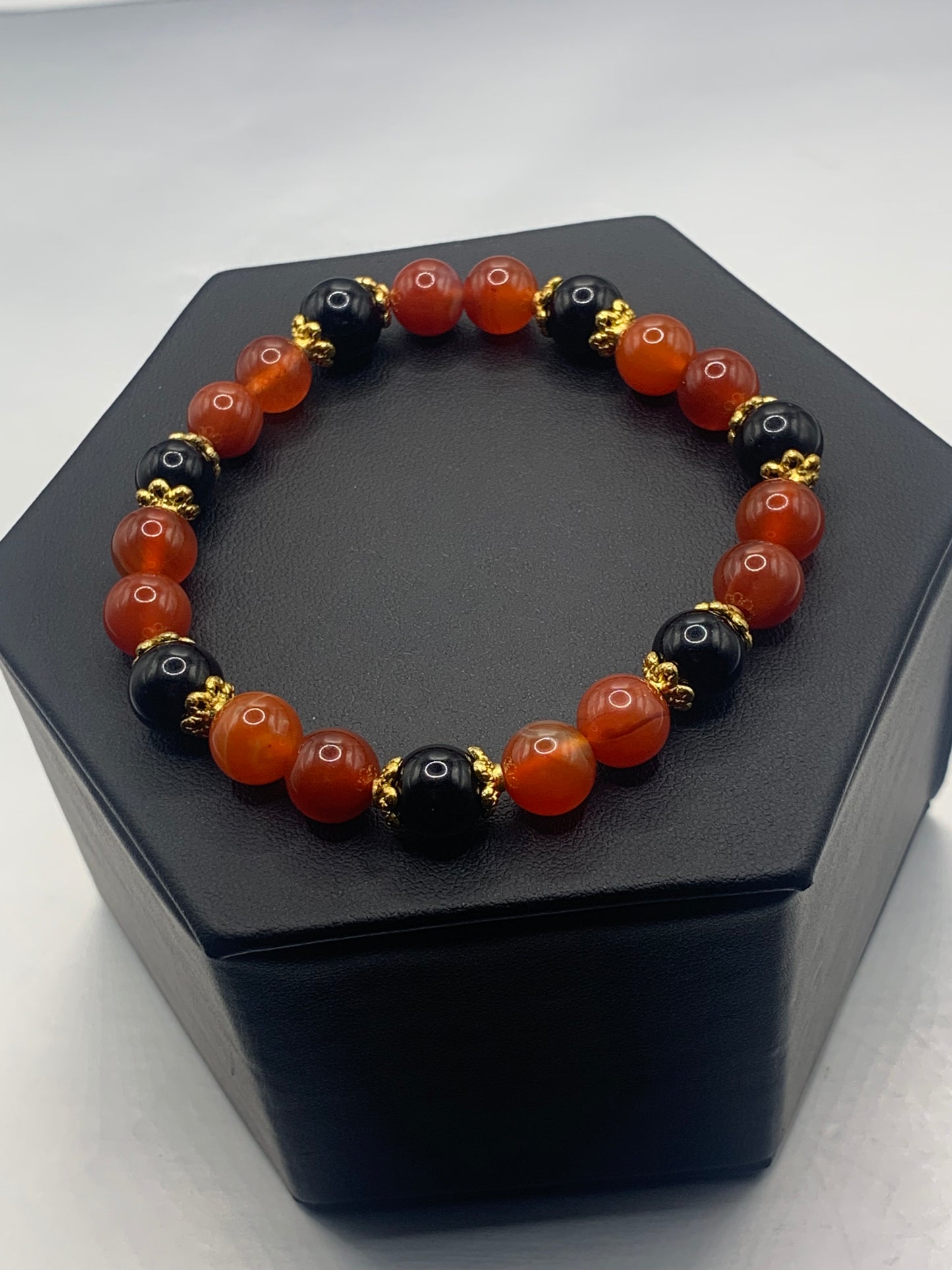 Black obsidian with orange agate semi precious stone/crystal beaded elastic bracelet with gold plated flower bead caps